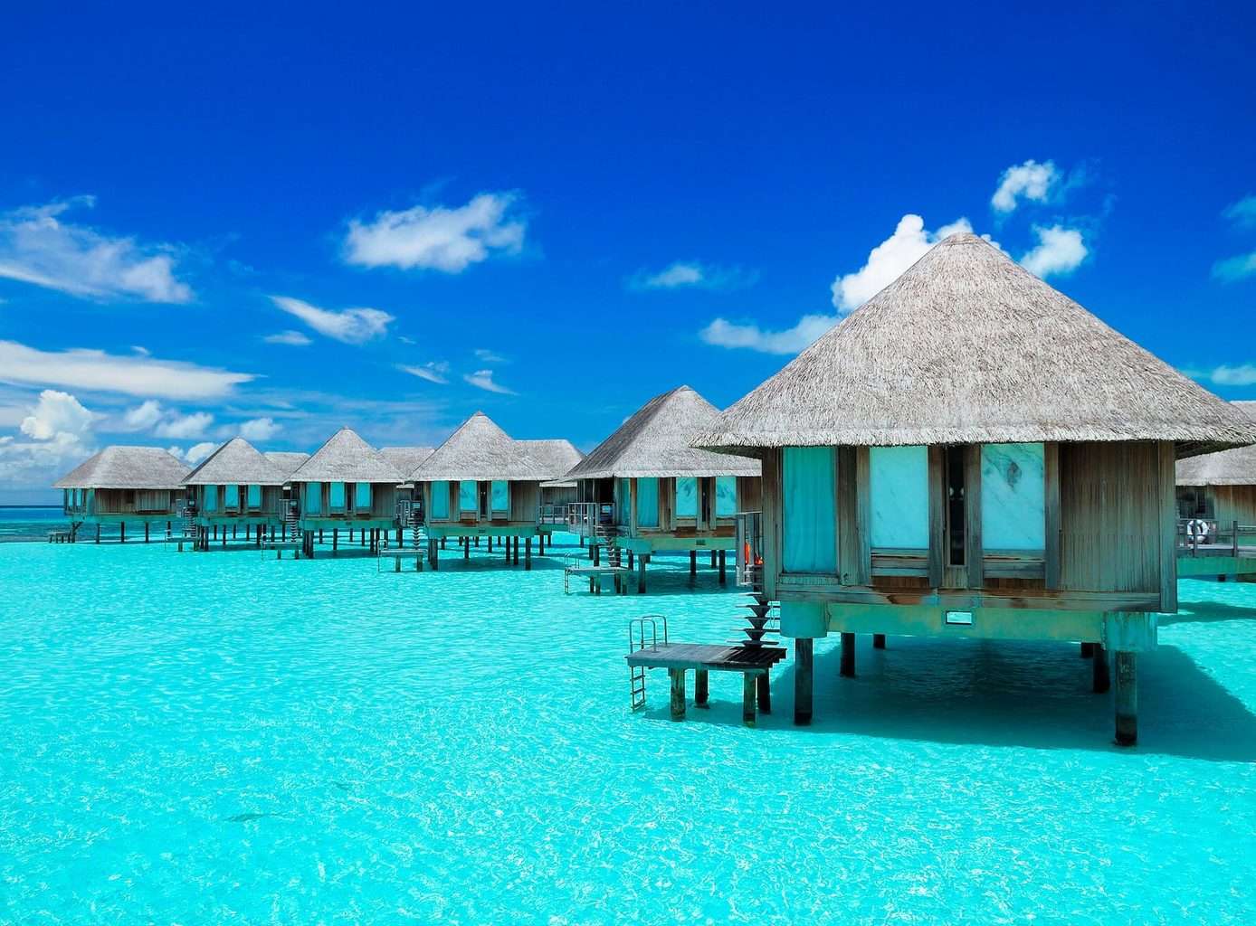 Asia Luxury Holidays and Indiann Ocean Calm, Overwater bungalow blue sea and sky view
