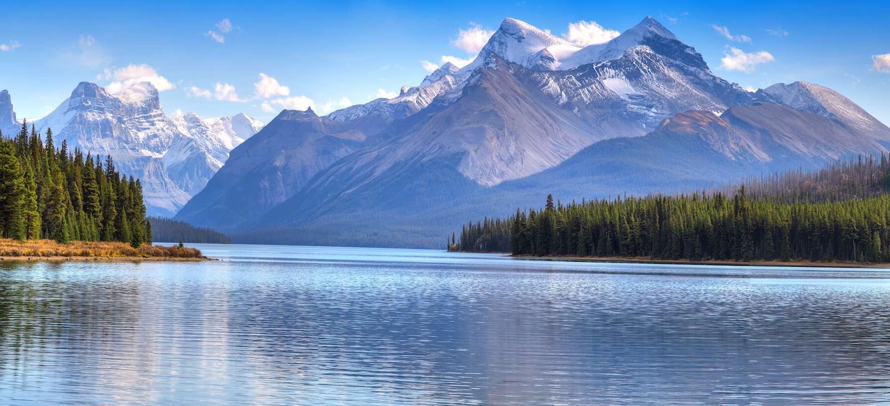 Luxury Canada Holidays - Beautiful mountain, spruce trees and lake shot