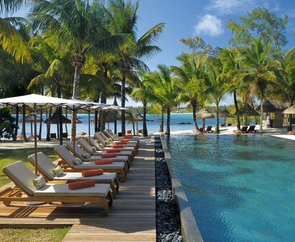 View of the swimming pool and sun loungers at Constance Le Prince Maurice in Mauritius