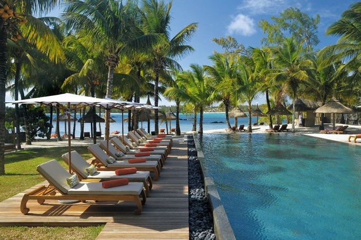 View of the swimming pool and sun loungers at Constance Le Prince Maurice in Mauritius