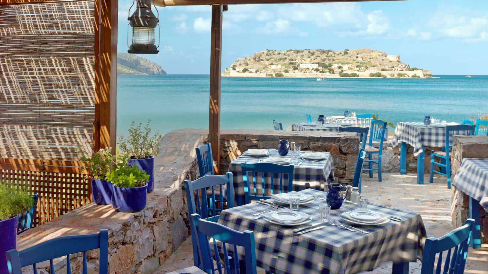 Dine and overlook the Mediterranean at Blue Palace, A Luxury Collection Resort, Crete.