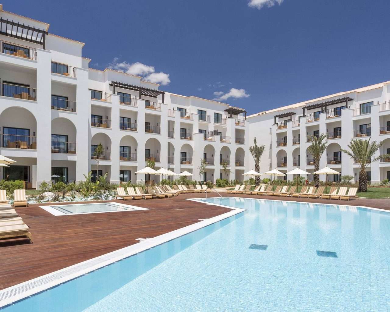 Pine Cliffs Hotel Algarve Offer pool and outside hotel building view
