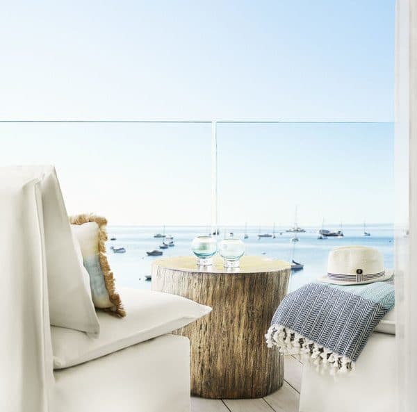 Close up view of the terrace seating, clean and contemporary, overlooking the sea at Nobu Hotel Ibiza Bay