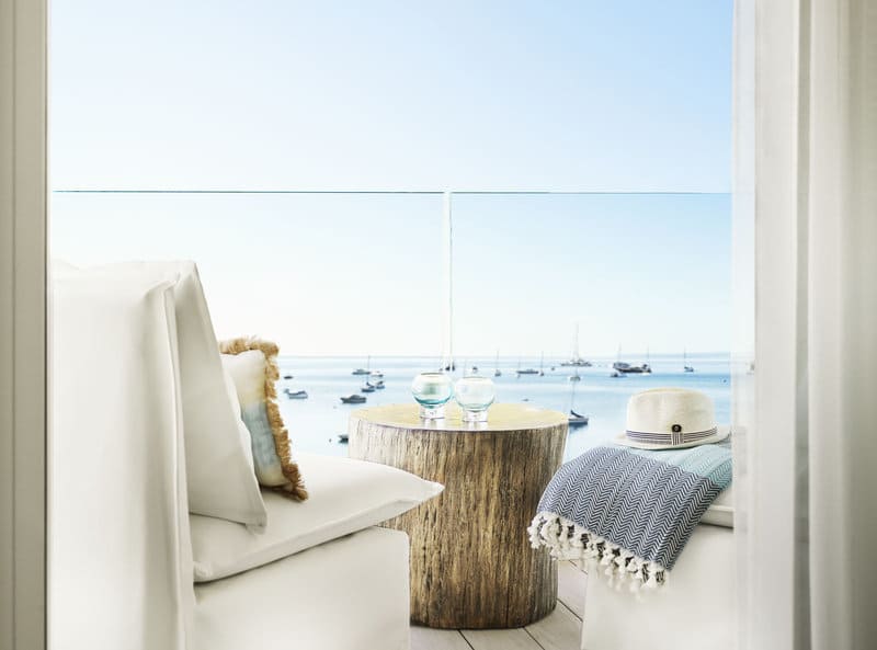 Close up view of the terrace seating, clean and contemporary, overlooking the sea at Nobu Hotel Ibiza Bay