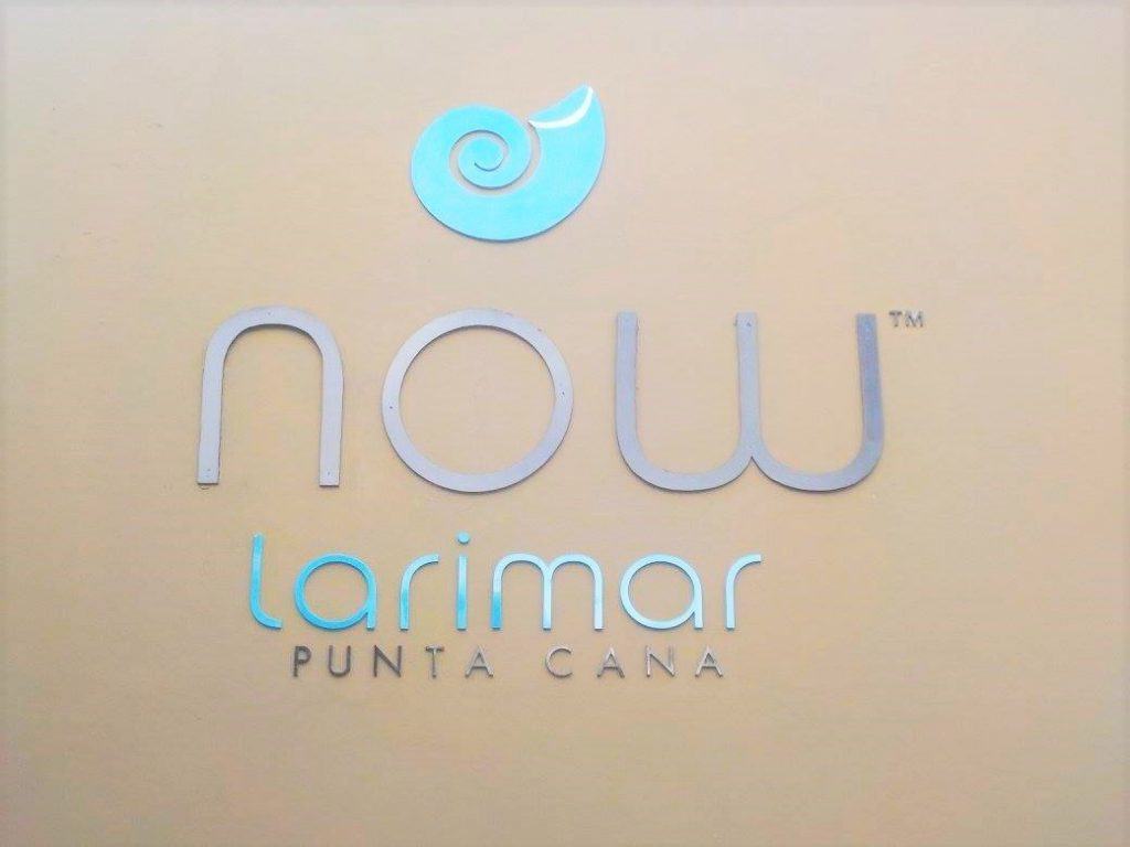View of the Now Larimar Punta Cana logo on the outside of the hotel