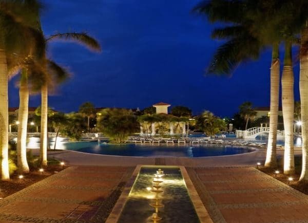 Night view of the swimming pool and palm trees at Paradisus Princesa del Mar in Varadero, Cuba