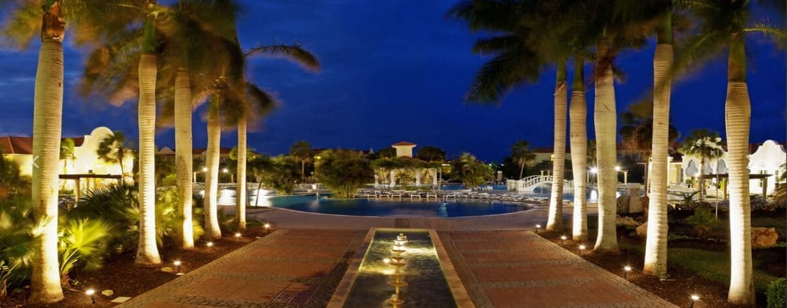 Night view of the swimming pool and palm trees at Paradisus Princesa del Mar in Varadero, Cuba