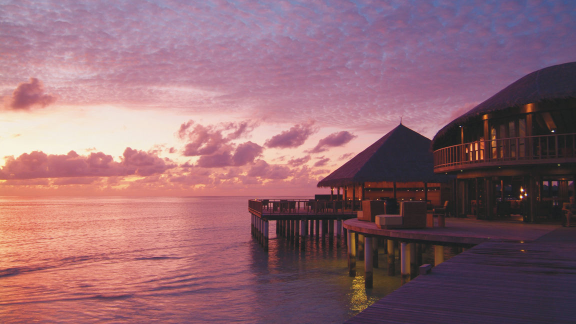 A pink and purple sunset at Coco Bodu Hithi in Maldives
