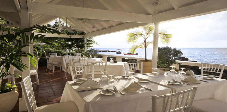 View of the dining area overlooking the beach at Cobblers Cove in Barbados