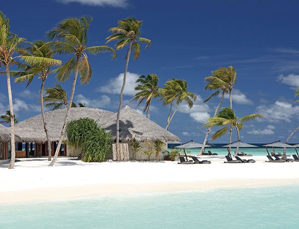 View of the beach and accommodation at Constance Halaveli in Maldives