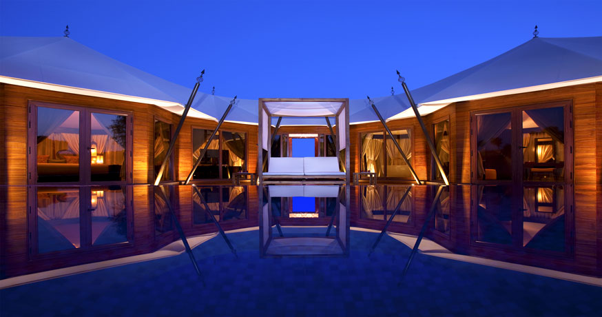 Exterior view at night of the Ritz-Carlton Ras Al Khaimah, Al Wadi Desert, UAE