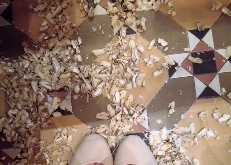 Peanut shells on the floor at Raffles Singapore Hotel