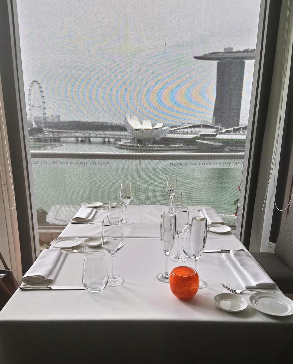 View of the Marina Bay from a table in The Lighthouse Restaurant at The Fullerton Hotel in Singapore