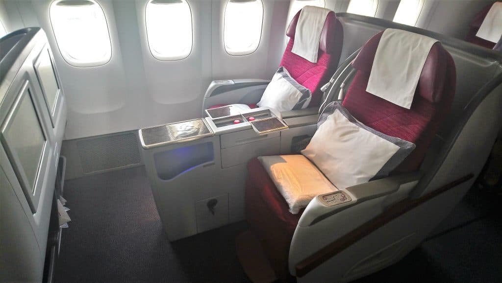 View of the aisle and window seats in Qatar Airways Business Class onboard the A330