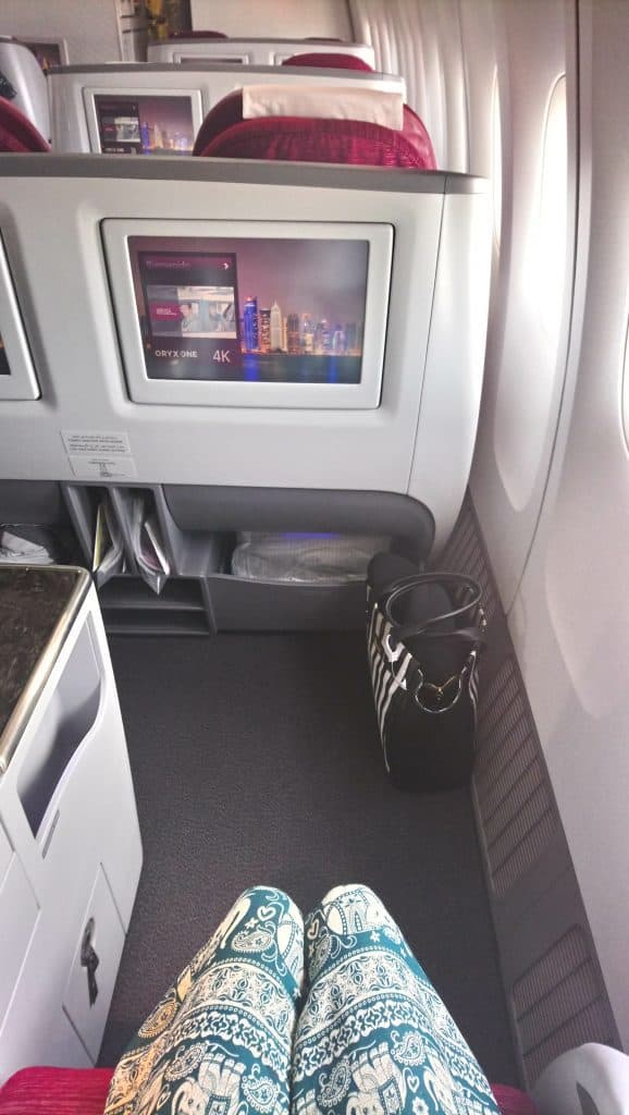 View of the legroom on Qatar Airways Business Class onboard the A330 for a window seat