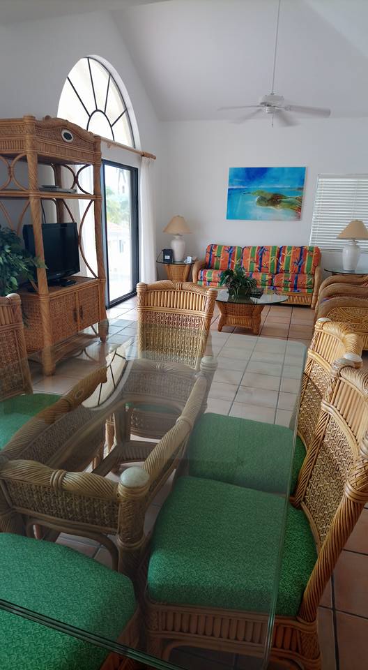 Dining area and lounge inside a two bedroom villa at St James Club Antigua