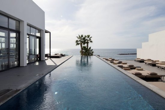 Swimming pool overlooking the sea at Almyra Hotel in Paphos, Cyprus